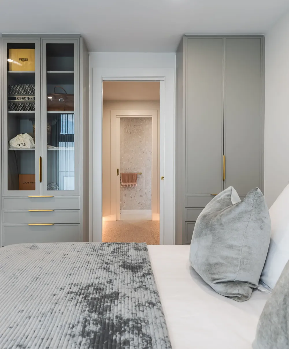 Bedroom with natural light and custom built-ins